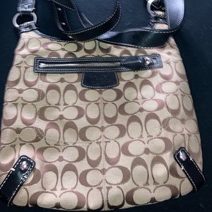 Tan and black coach crossbody